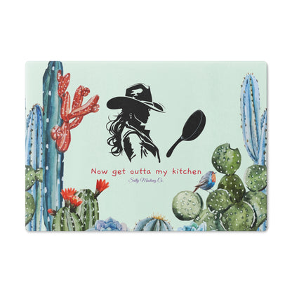 Blue Tone Cactus Border, Cowgirl With Cast Iron Skillet, "Now Get Outta My Kitchen" Glass Cutting Board