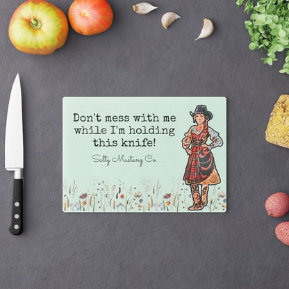 "Don't mess with me while I'm holding this knife!" Cowgirl Cutting Board