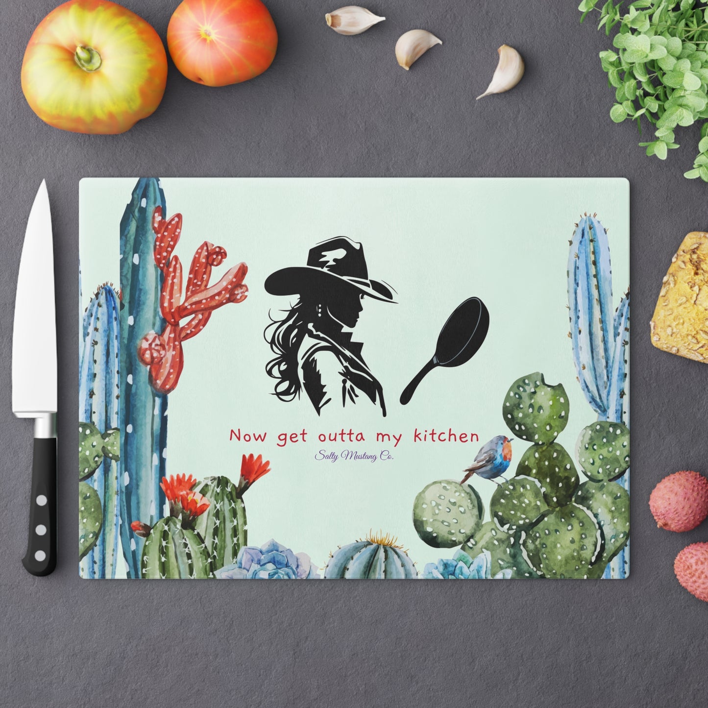 Blue Tone Cactus Border, Cowgirl With Cast Iron Skillet, "Now Get Outta My Kitchen" Glass Cutting Board