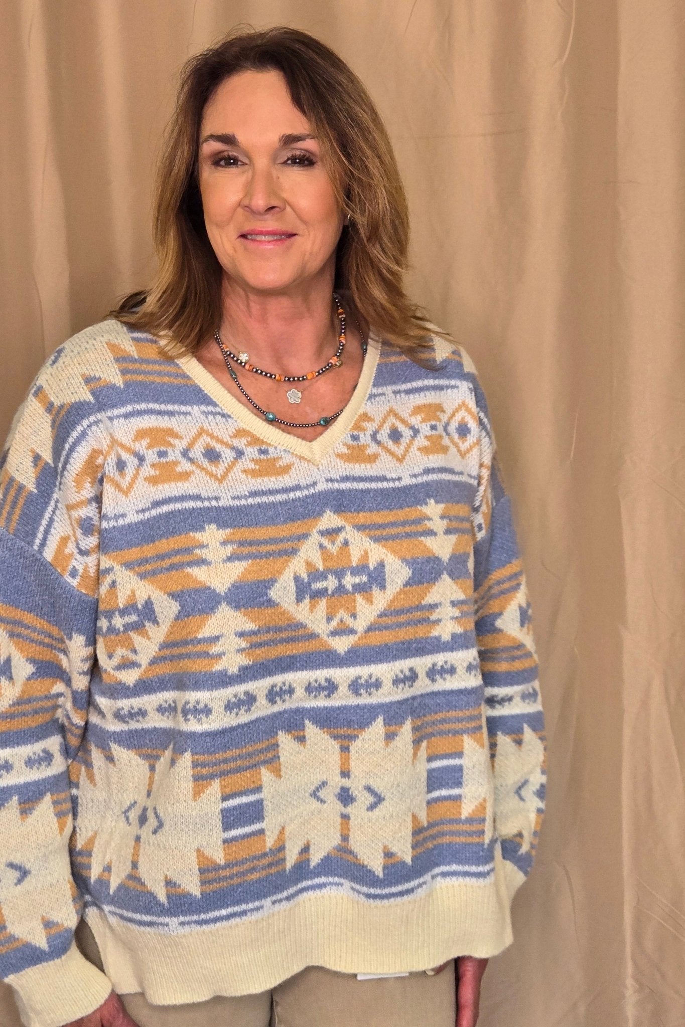 Main Strip Southwestern Knit Sweater — Oversized V-Neck with Bold Blue, Tan & Cream Print
